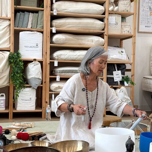 Mi Sun playing a crystal singing bowl during the sound healing